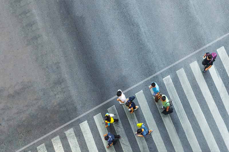 pedestrian accident lawyers group of people crossing the street on a pedestrian lane