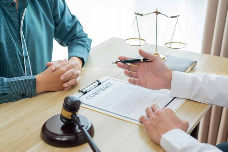 San Bernardino top rated injury lawyer injured man discussing case with a lawyer