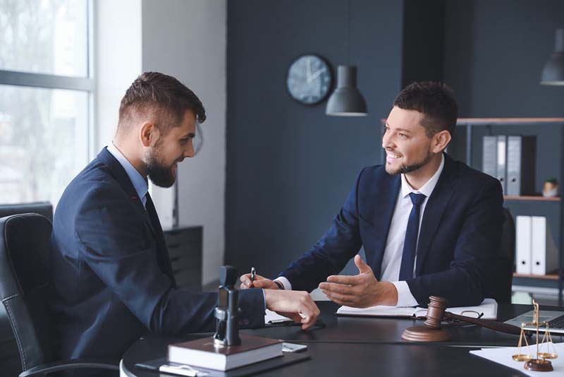 lawyer meeting with client lawyer talking with a client