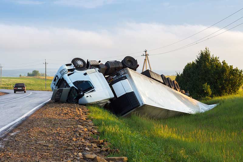 rolled over white truck