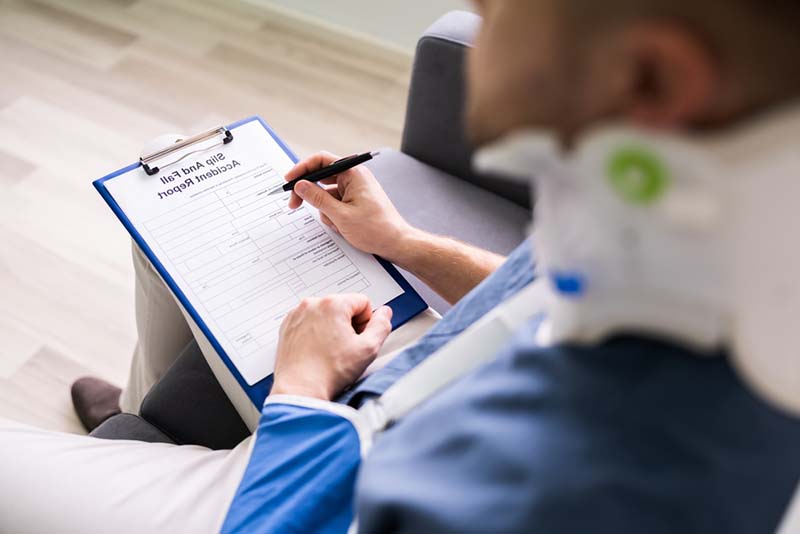 worker filing injury report after an accident