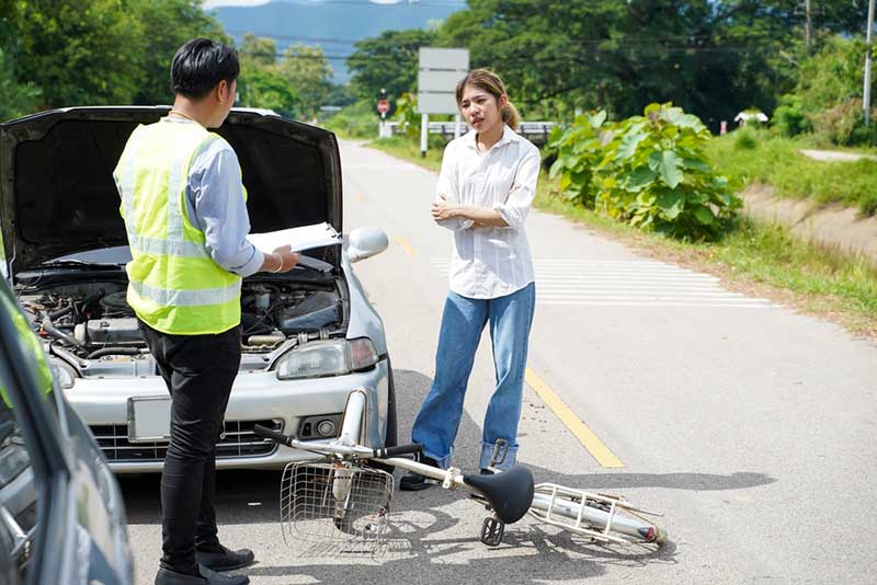 car and bicycle accident talking after an accident