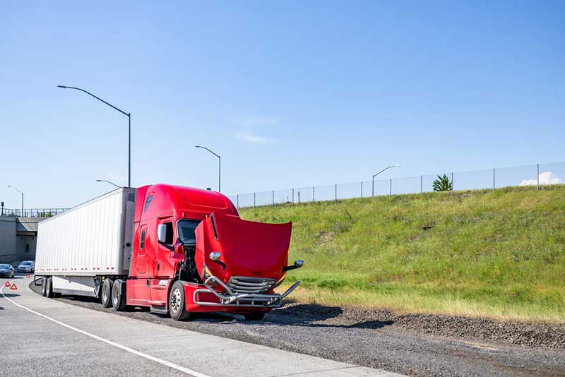 broken down red big truck