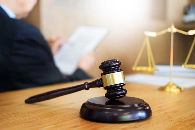 gavel and lawyer in the background