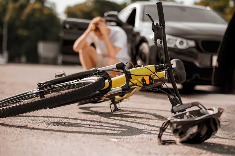 bicycle on ground after accident yellow bicycle on ground after accident